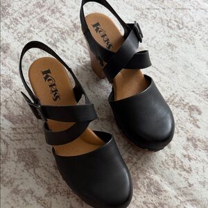 Korks Black Leather Crisscross Slingback Clogs with Buckle